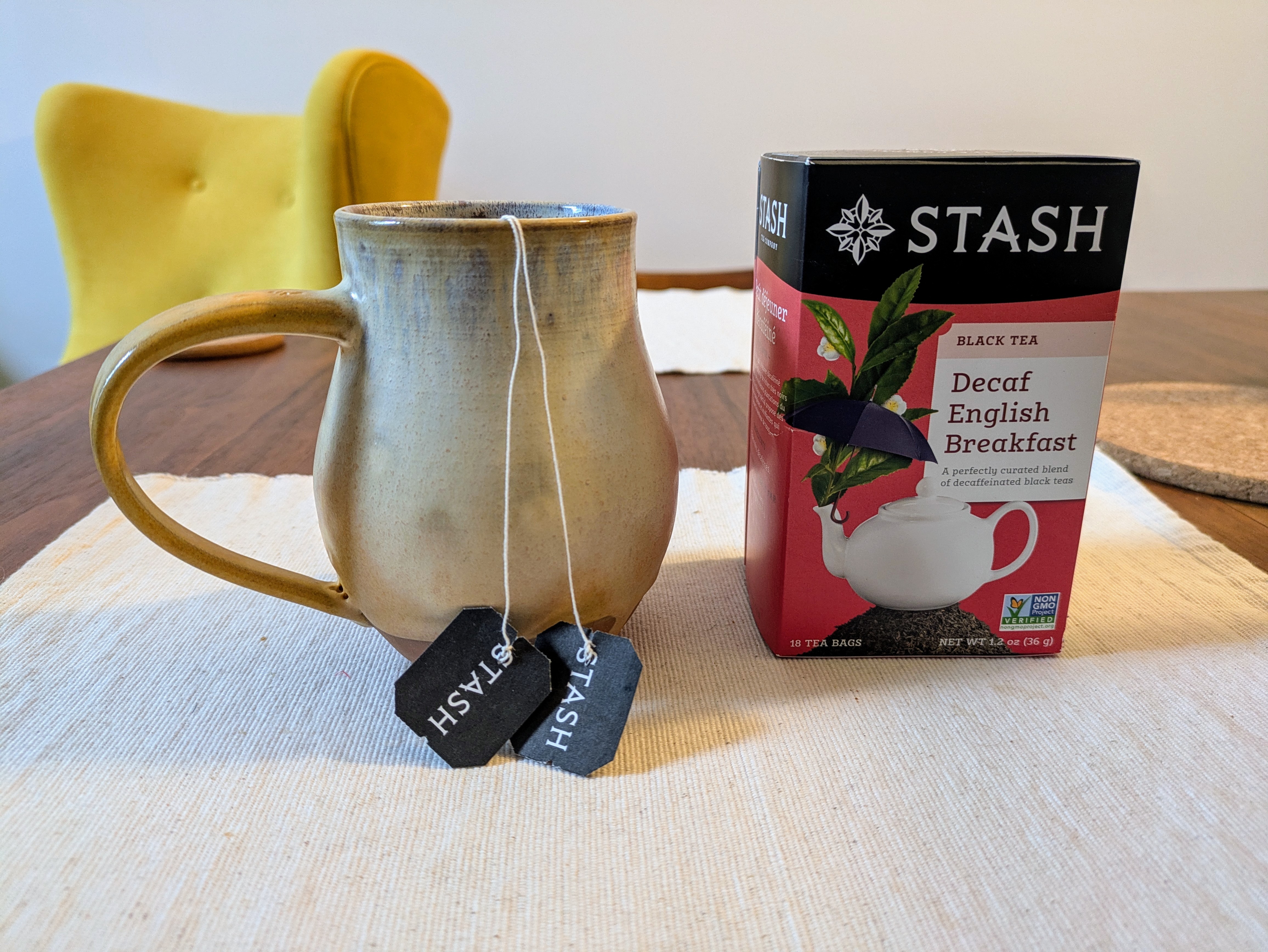 Mug with two Stash Decaf English Breakfast teabags and their box